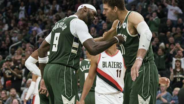 Milwaukee Bucks forward Bobby Portis (9) celebrates with center Brook Lopez (11) after scoring a basket